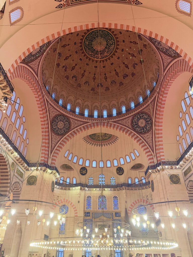 Ornate interior dome of Suleymaniye Mosque, architectural highlight of an Istanbul itinerary