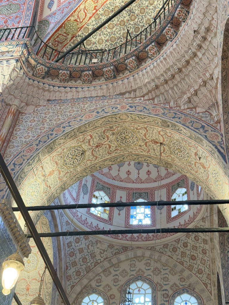 Decorative arches and ceiling inside Yeni Mosque, historic interior of an itinerary