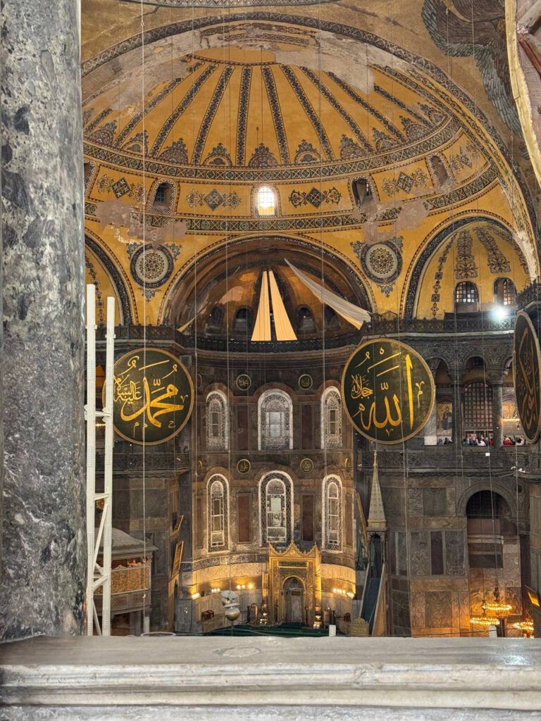 Grand interior of Hagia Sophia Istanbul with calligraphy, must-see stop on an itinerary